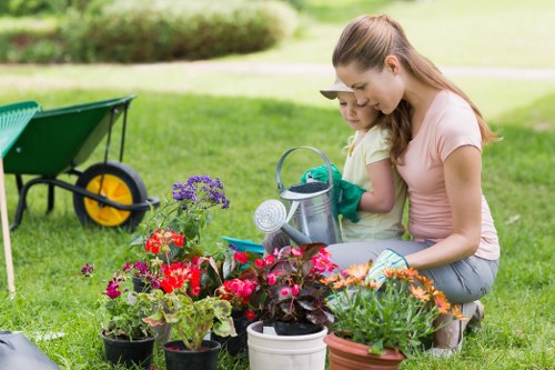 Technician inspecting equipment before lawn mowing task